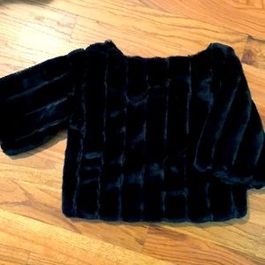 Very stylish,black cropped faux fur sweater. In excellent condition!